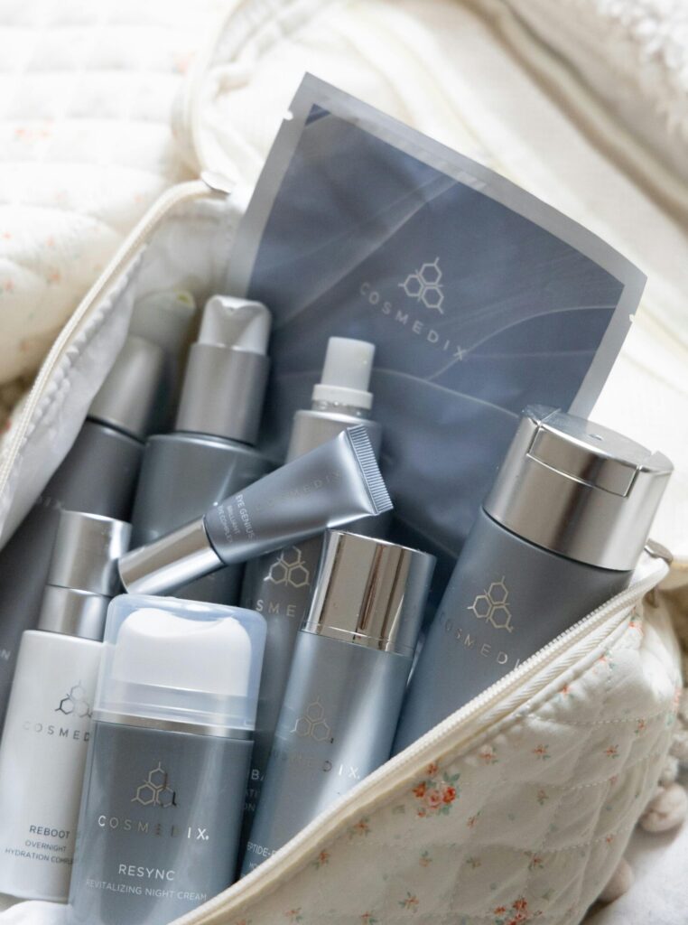 A selection of skincare products neatly arranged in a quilted travel bag for easy access.